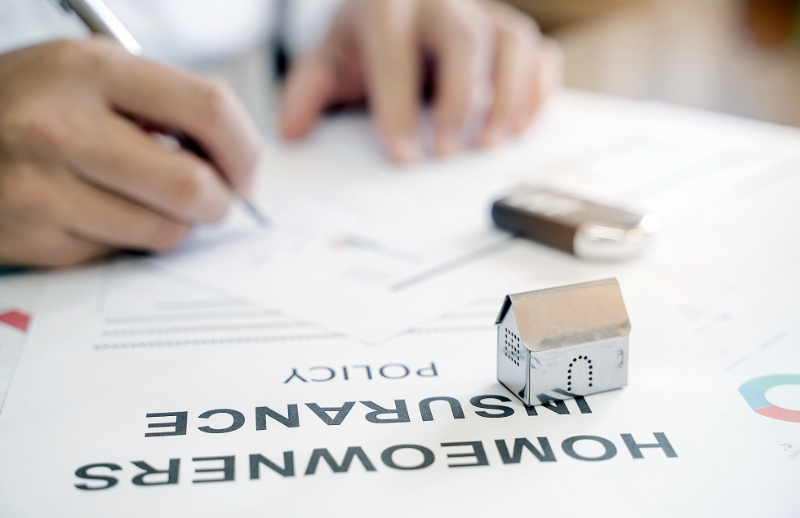 man filling insurance paper