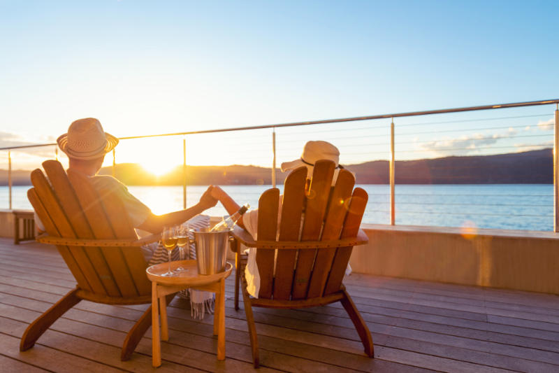 couple sitting while watching sunset