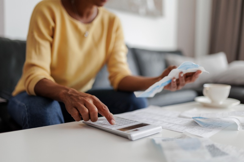 Close up of a mid adult woman checking her energy bills