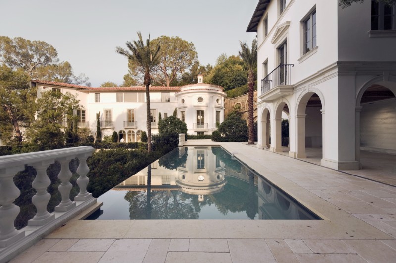 Exterior photo of a Bel Air mansion featuring a pool